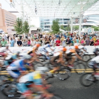 The riders speed through a crowded section of the course