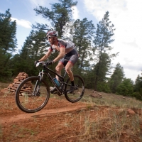 A racer catches air on the Burma Trail