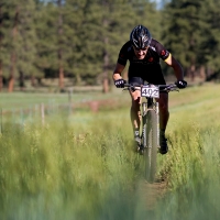 A racer from the Light and Motion team heads toward the finish