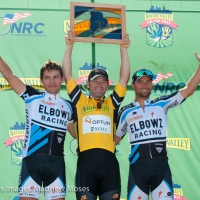 Michael Friedman stands on the top step between Andres Diaz and Eric Marcotte