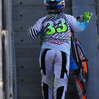 Dani George walks her bike up the ramp