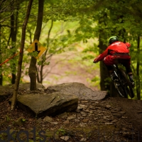Luca Shaw scrubbing a drop on the lower half of the course.