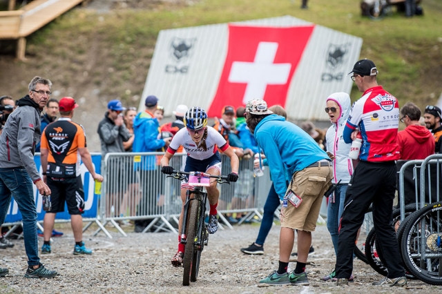 Kate Courtney receives encouragement as she races to victory at the World Cup in Lenzerheide